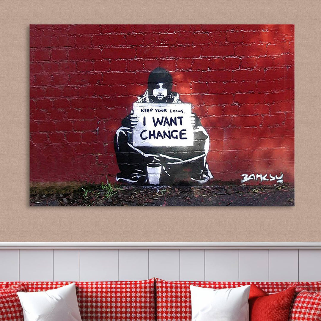 The living room showcases a triptych of stencil artwork on museum-quality canvas, featuring the Banksy I Want Change Graffiti Abstract Wall Art Canvas Print. This captivating piece depicts a person holding a sign that says "I want change" and is finished with a UV-protective coating to ensure long-lasting beauty.