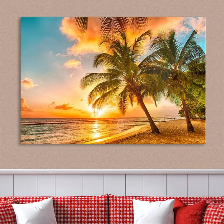 The Tropical Sunset Wall Art Print features a vibrant beach scene with palm trees and an ocean view highlighted by a golden sunset.