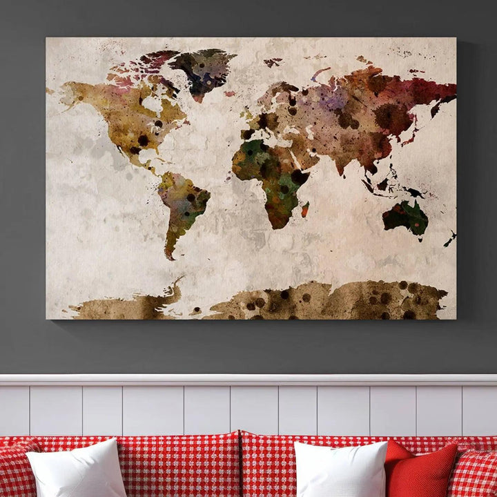 A Watercolor World Map Canvas Print, wrapped in an elegant gallery style, hangs on the wall.