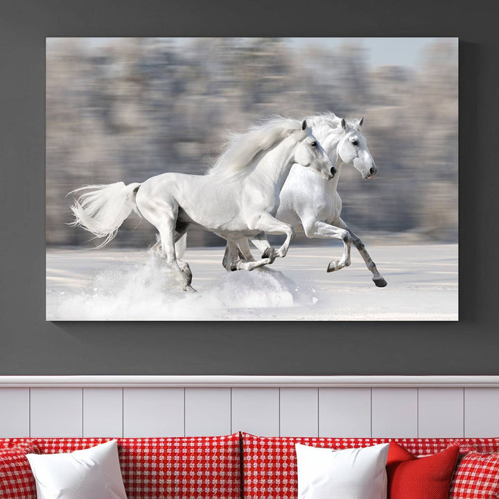 The "All The White Horses Wall Art Canvas Print" depicts a triptych of galloping white horses across a snowy landscape. These museum-quality canvases come with a UV-protective coating to maintain their stunning appearance over time.