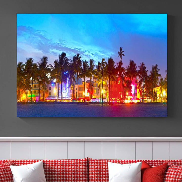 The living room features a three-panel Miami City Wall Art Canvas Print, showcasing a colorful, illuminated beach scene with palm trees on museum-quality canvas.