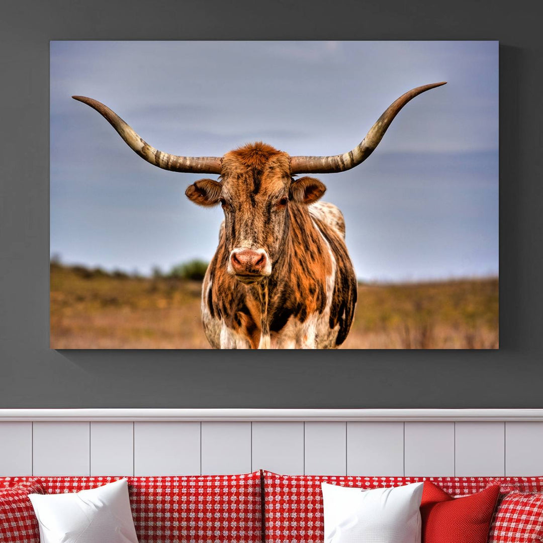 The Texas Longhorn Wall Art Print, a triptych canvas artwork depicting a longhorn bull in a field, features a gallery-quality finish.