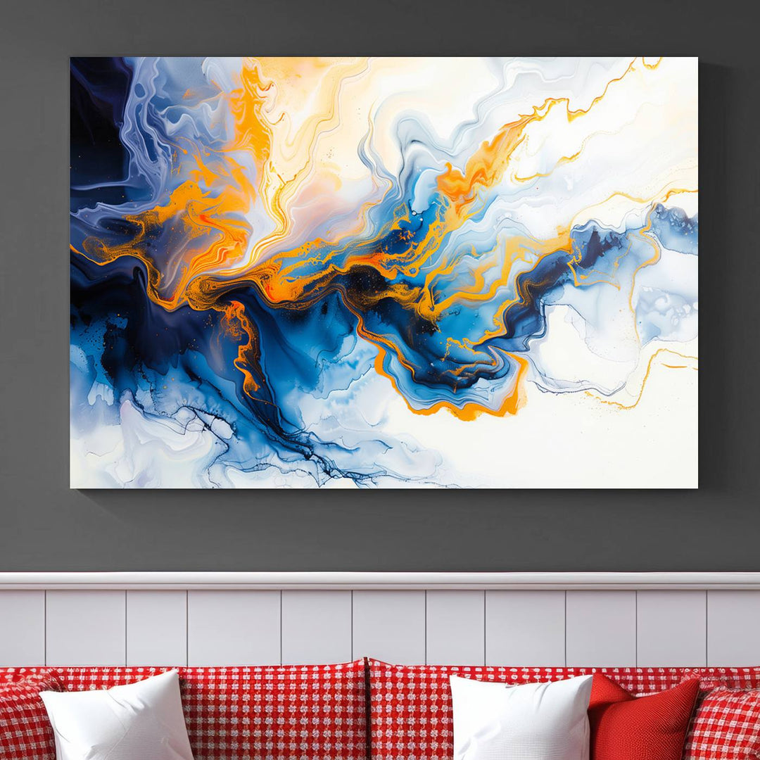 A stunning Fluid Alcohol Ink Wall Art with Gold Wall Art Canvas Print, featuring vibrant blue, orange, and white swirls, adorns the wall. This gallery-quality finish adds an exquisite touch to any living space.