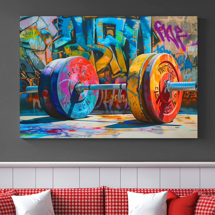 The Fitness Gym Barbell Graffiti Wall Art Canvas Print, a vibrant triptych featuring a barbell against a graffiti backdrop, elegantly hangs in the room. Crafted on premium canvas with a gallery-quality finish, this stunning piece of wall art effortlessly combines urban flair with sophisticated decor.