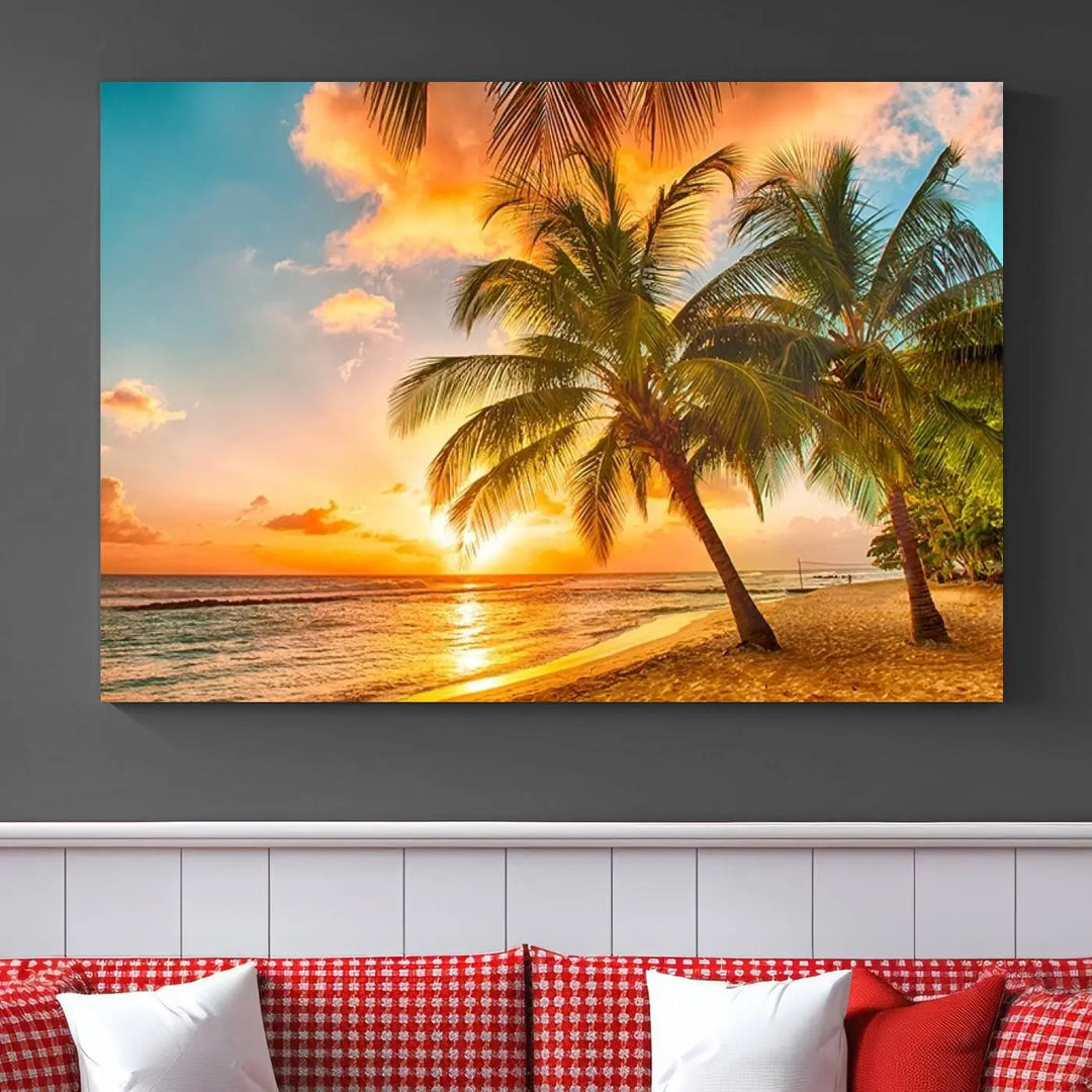 The Tropical Sunset Wall Art Print features a vibrant beach scene with palm trees and an ocean view highlighted by a golden sunset.