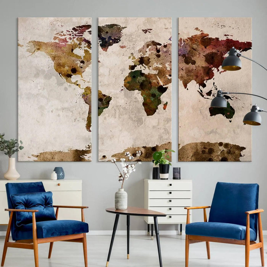 A Watercolor World Map Canvas Print, wrapped in an elegant gallery style, hangs on the wall.