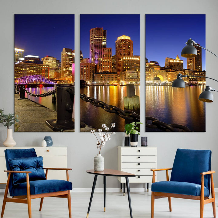 The "Boston City Night Skyline Cityscape View Wall Art Canvas Print" beautifully portrays a stunning triptych of a city skyline illuminated against the night sky, elegantly reflected in the river below. These museum-quality canvases are gallery wrapped to ensure an elegant presentation that enhances any space.