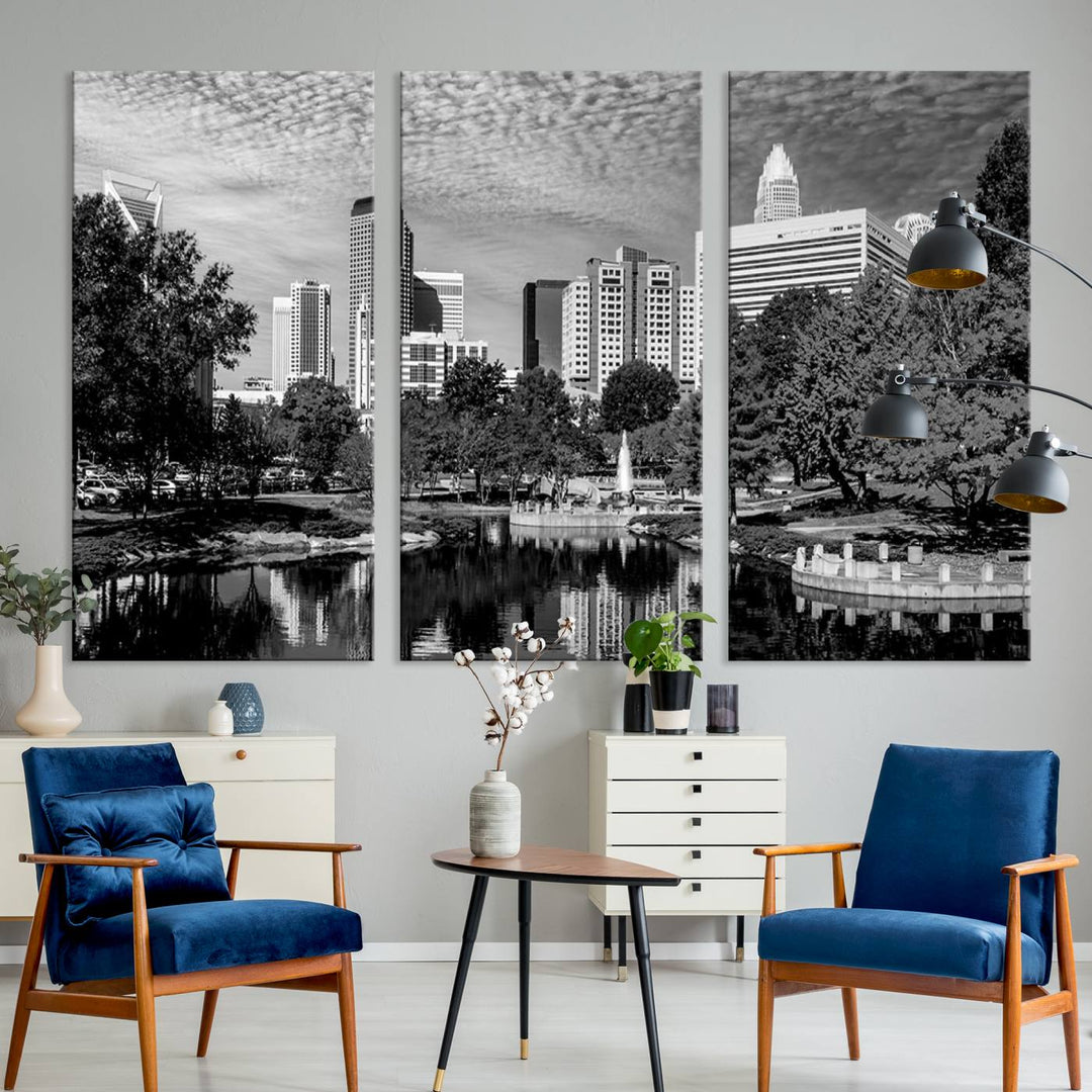 The living room features a captivating triptych titled "Charlotte City Cloudy Skyline Black and White Wall Art Cityscape Canvas Print," crafted on museum-quality canvas with UV-protective coating. Modern decor accentuates the dynamic scene.