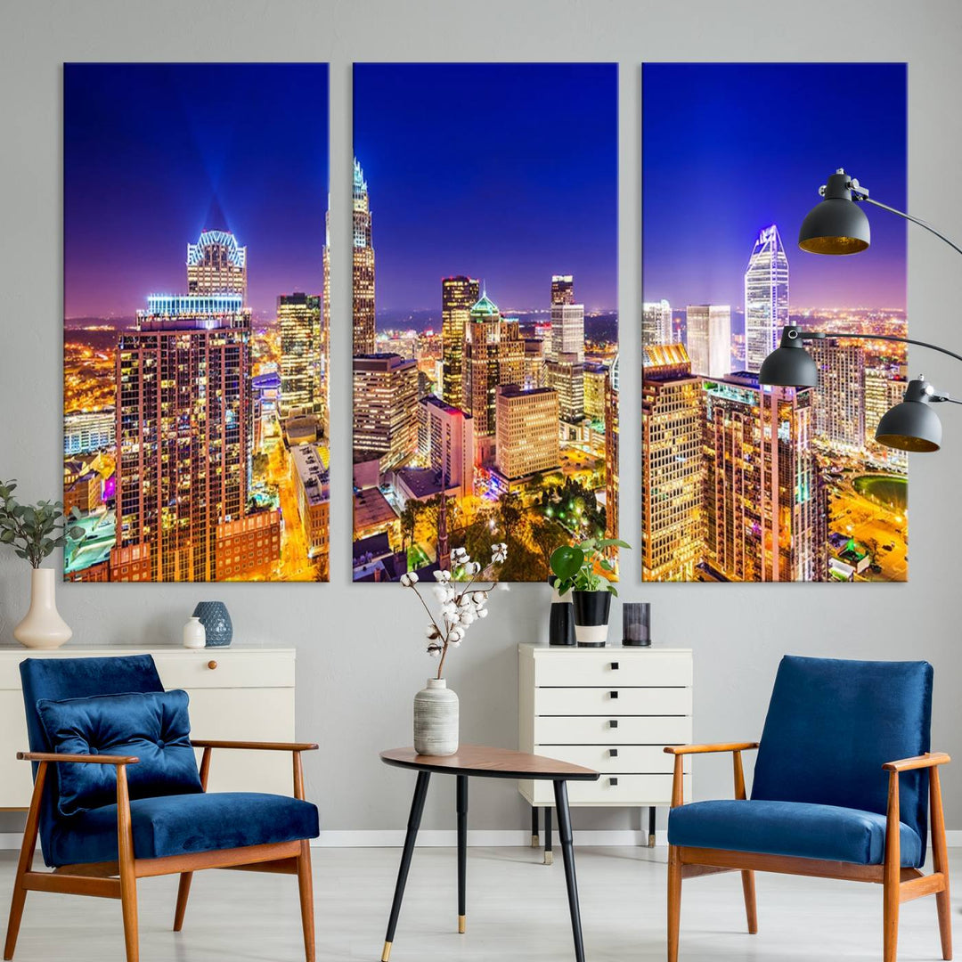 A modern living room features the Charlotte City Lights Night Blue Skyline Cityscape View wall art canvas print.