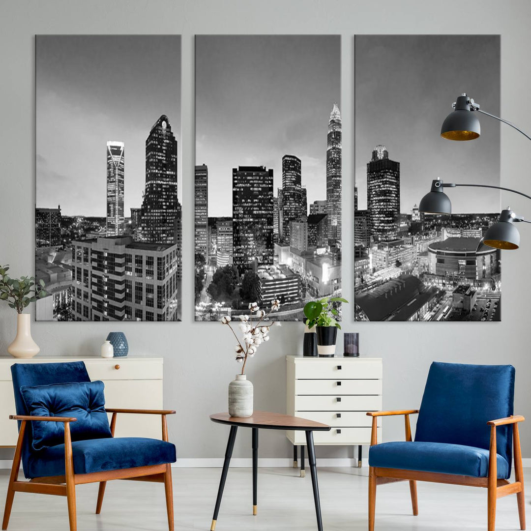 The "Charlotte City Cloudy Skyline Black and White Wall Art Cityscape Canvas Print" hangs on a dark wall, showcasing its UV-protective properties for enduring beauty.