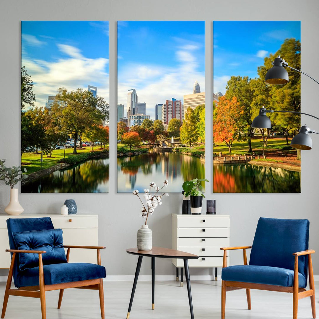 The Charlotte City Park at Spring Skyline Cityscape View wall art canvas print is a triptych featuring a scenic park with a lake and city skyline. It is gallery-wrapped on museum-quality canvases.