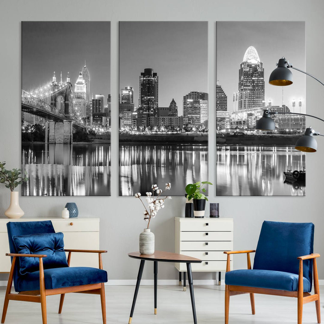 The "Cincinnati City Lights Skyline Black and White Wall Art Cityscape Canvas Print" is elegantly displayed in a stylish living room.