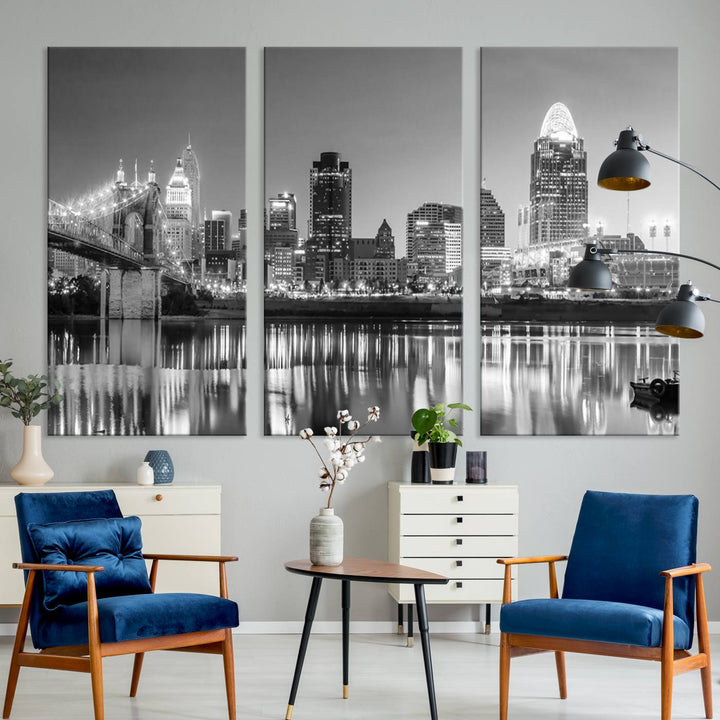 The "Cincinnati City Lights Skyline Black and White Wall Art Cityscape Canvas Print" is elegantly displayed in a stylish living room.