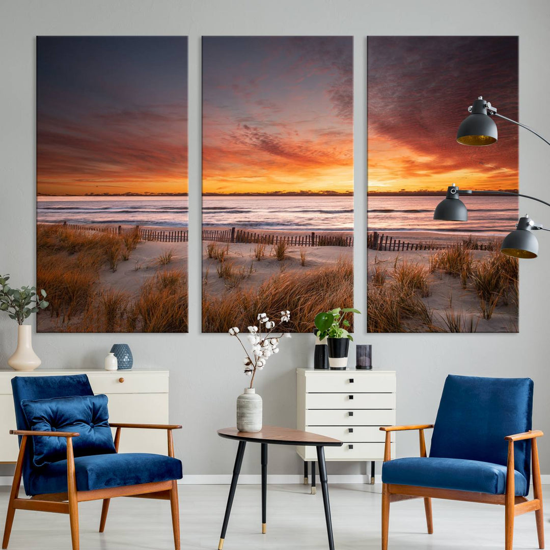 Sunset on The Beach Wall Art Canvas Print features a triptych of a beach at sunset with vivid orange skies, presented on museum-quality canvas. Each section is gallery wrapped, offering lasting beauty with its UV-protective coating.