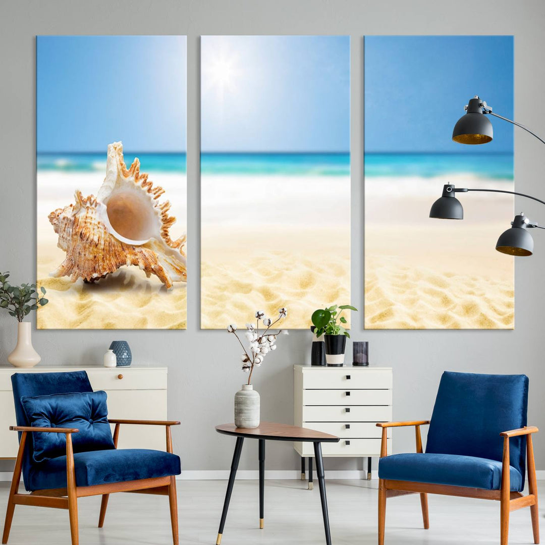 The Sea Shell on The Beach Sun Sand Wall Art Canvas Print is a triptych that beautifully captures a beach scene with a large seashell on the sand.