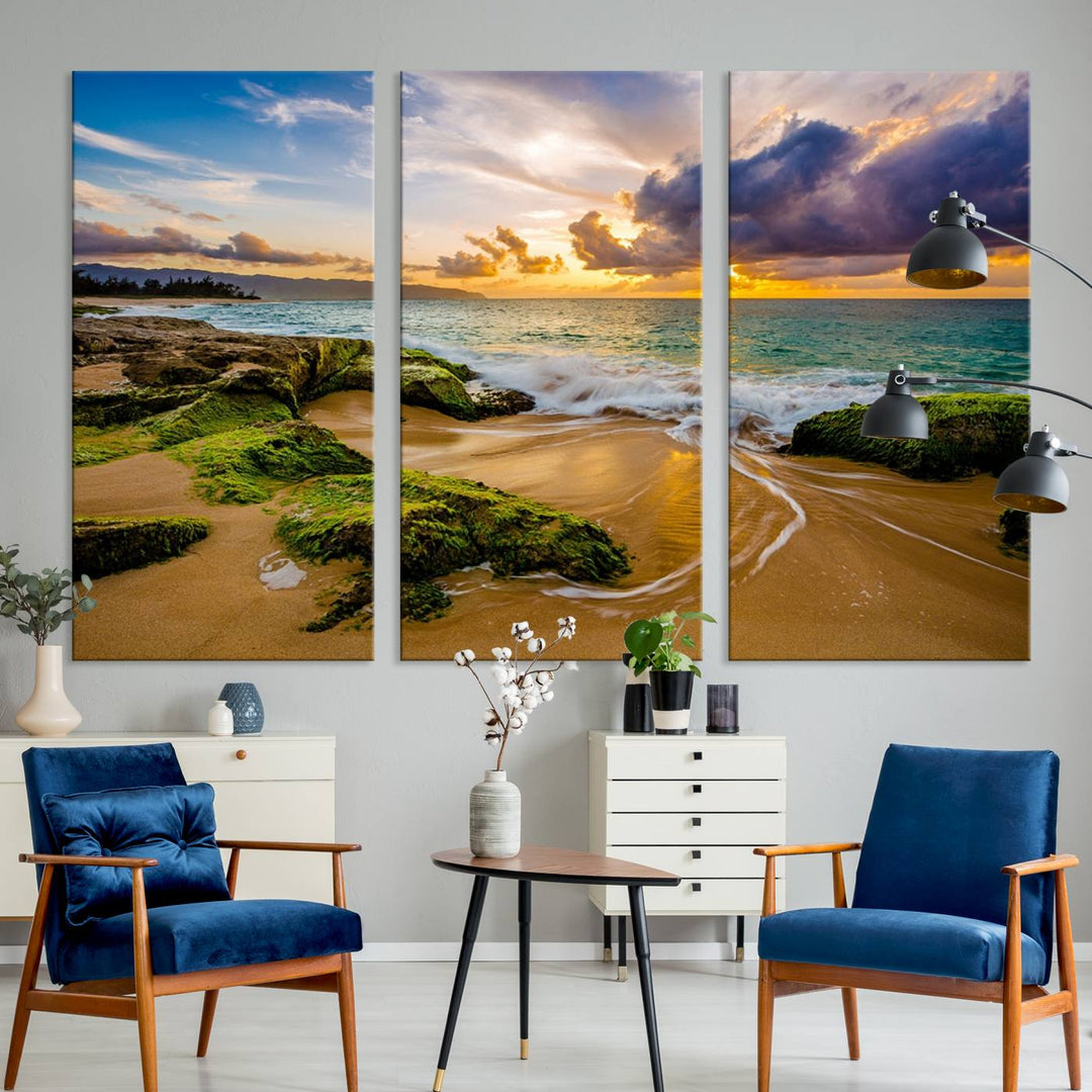 The Sunset Beach Wall Art Canvas Print is a gallery-wrapped triptych showcasing a beach scene with mossy rocks and a vibrant sunset. Made from museum-quality canvas and featuring a UV-protective coating, it elegantly provides both beauty and durability.