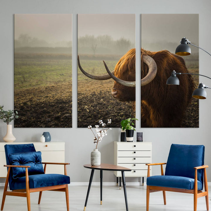 The "Big Cow Horn Wall Art Canvas Print" is a hand-assembled framed canvas depicting a Highland cow in a misty field. It is crafted with a UV-protective coating to ensure lasting vibrancy.