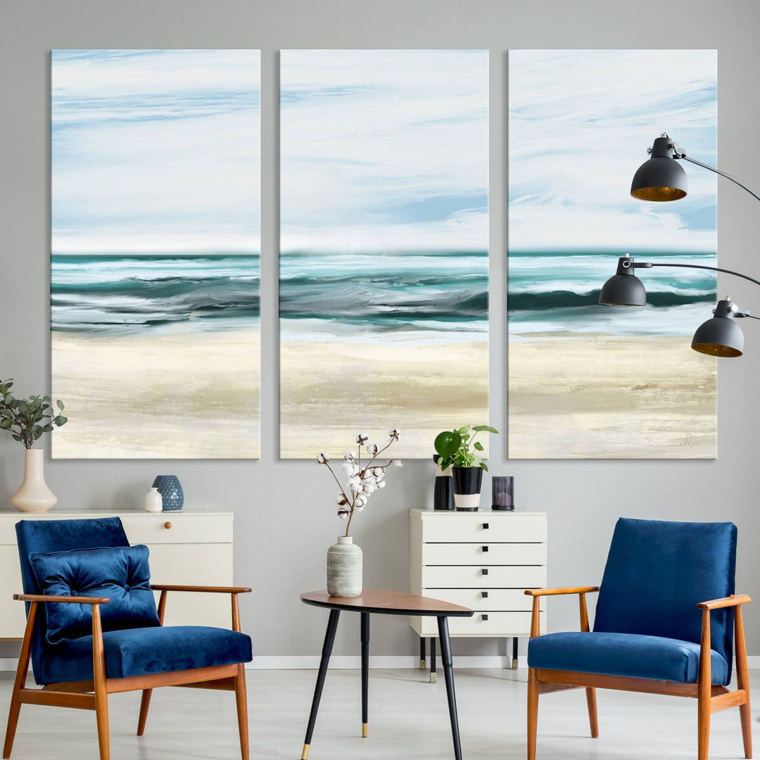 The room features the Ocean Abstract Wall Art Canvas Print, a triptych beach painting on museum-quality canvas with a gallery-wrapped finish and UV-protective coating.