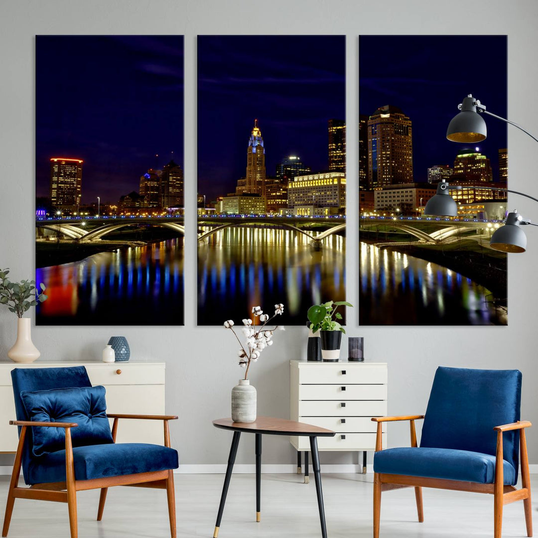 The "Columbus City Lights Night Skyline Cityscape View Wall Art Canvas Print" showcases a stunning city skyline at night, with illuminated buildings and bridges reflecting in the river, on a museum-quality canvas ready to hang.