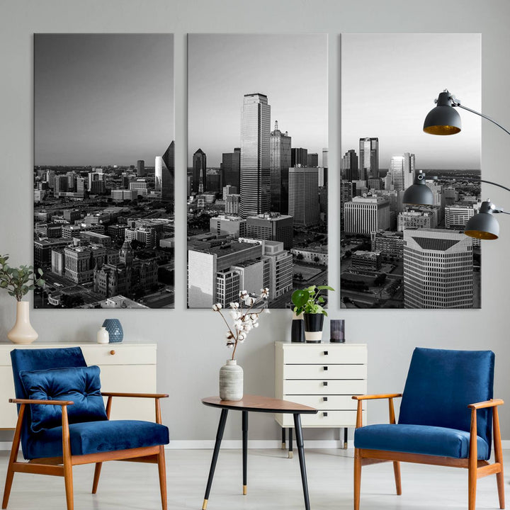 A modern living room showcases the Dallas City Lights Skyline Black and White Wall Art Cityscape Canvas Print. This gallery-wrapped piece offers a sleek finish and is crafted from museum-quality pollycotton. It features a UV-protective coating to ensure lasting vibrancy.