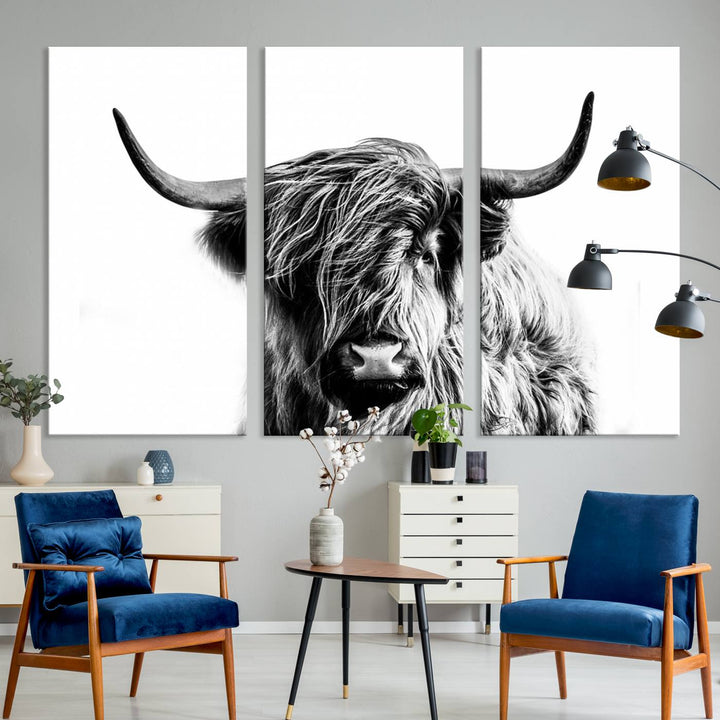 The Scottish Highland Cow Cattle Art Print Farmhouse Wall Art Canvas Print enhances rustic farmhouse decor with its depiction of a long-haired, large-horned cow. This triptych is an ideal choice for chic wall art.