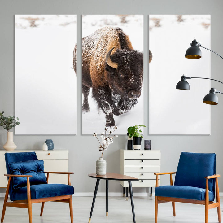 The Bison Winter Wall Art Canvas Print for Farmhouse Decor is displayed as a triptych in the living room. This artwork, printed on museum-quality canvases with a UV-protective coating to maintain its vibrant colors, is the focal point of the space.