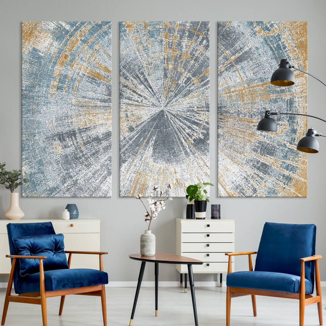 The Radiant Abstract Wood Rings Canvas Art, a modern triptych wall decor, enhances the contemporary style of the living room with its blue, white, and gold hues.