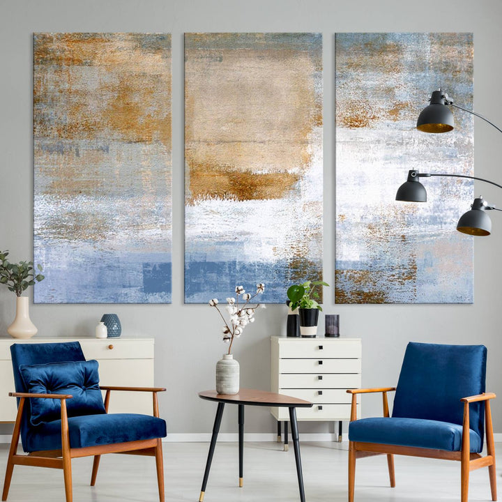 The Blue Multi Panel Abstract Wall Art Canvas Print, featuring an elegant blend of blue, beige, and brown tones, hangs gracefully on the wall, adding a contemporary touch to the space.