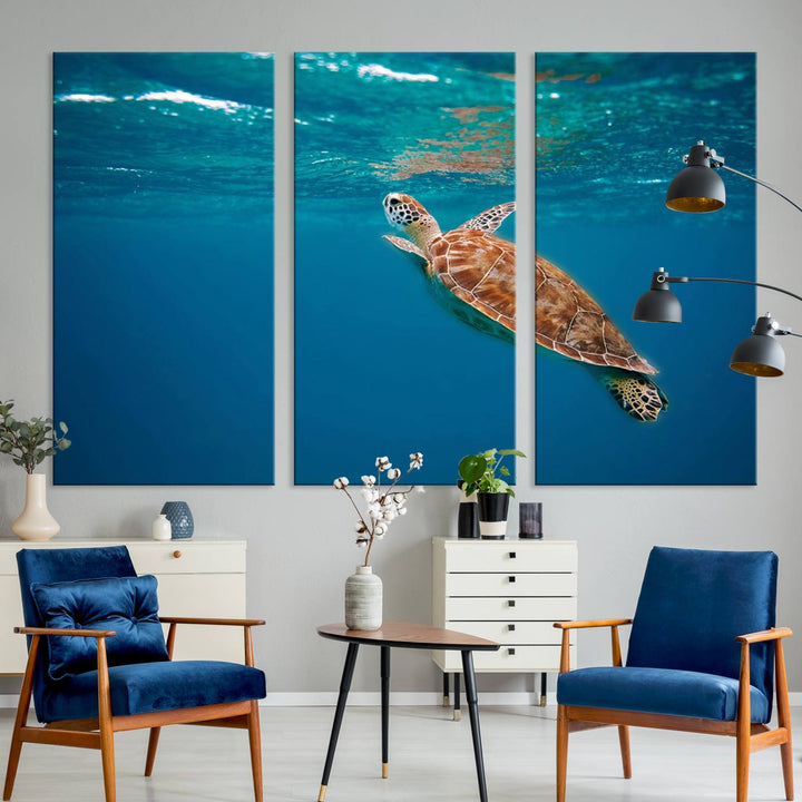 The living room features the "Baby Turtle in Ocean" wall art canvas print. This gallery-quality piece, depicting a sea turtle swimming underwater, adds an elegant touch to the space.