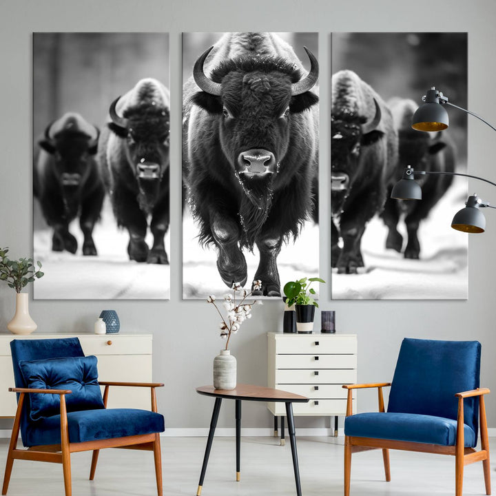 A modern living room features a striking black-and-white American Bison Art | Buffalo Herd Wall Art Canvas Print on the wall.