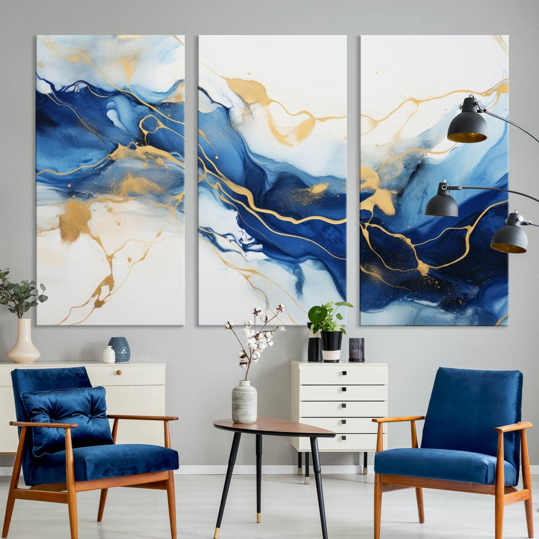 The Blue Abstract Wall Art is displayed as a triptych on museum-quality canvas, showcasing a blue and gold abstract design. The artwork includes a UV-protective coating to maintain its vibrancy and comes with the benefit of free shipping.