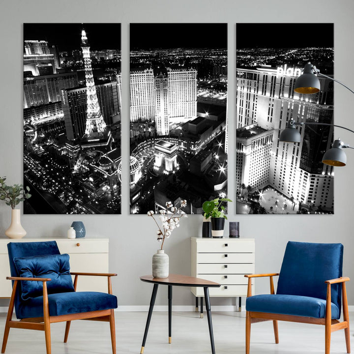 The Las Vegas Wall Art Canvas Print is a black and white triptych that showcases a city skyline at night. Crafted on museum-quality canvas with a UV-protective coating, it serves as an elegant and ready-to-hang focal point in the room.