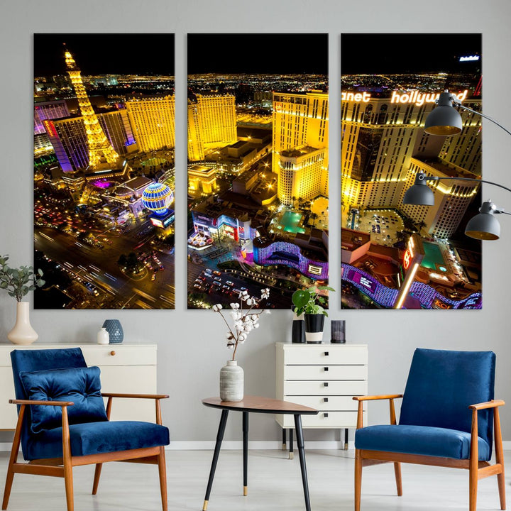 The modern living room features a Las Vegas Wall Art Canvas Print, a museum-quality triptych showcasing a vibrant cityscape with neon lights.