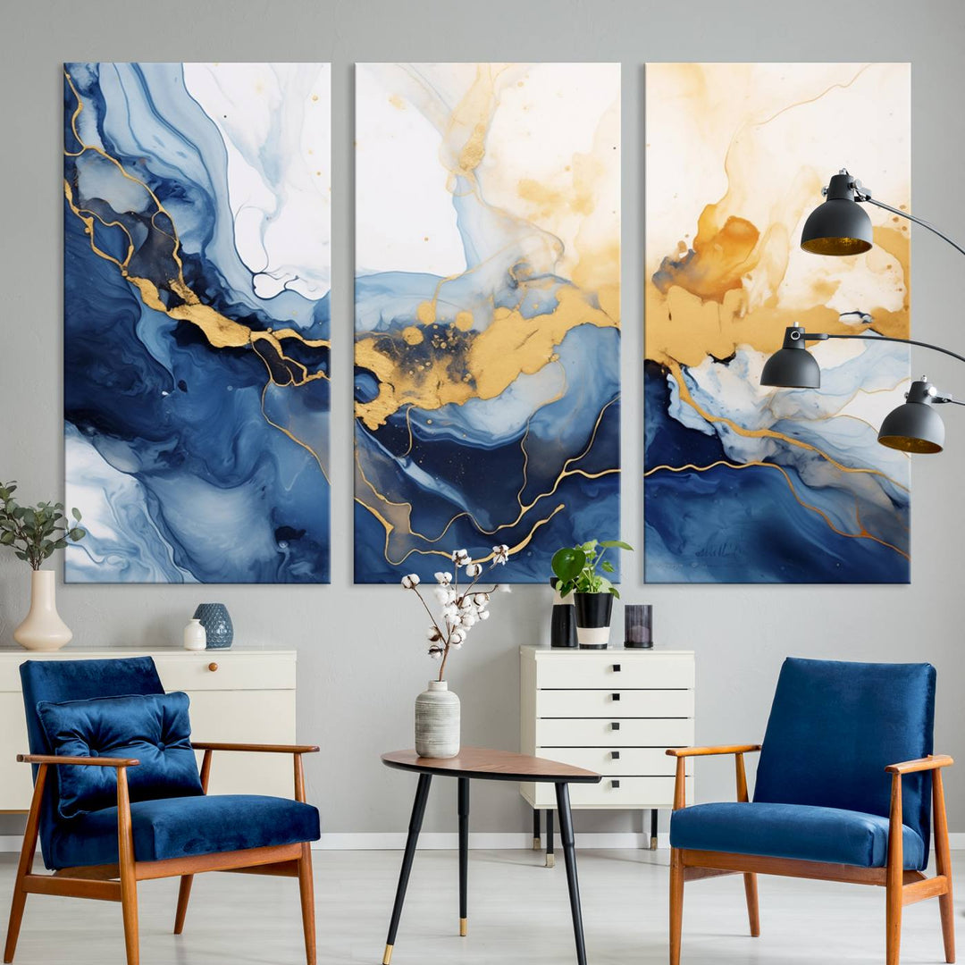 A contemporary living room featuring the "Navy Blue Gold Abstract Wall Art Canvas Print" on the wall, displayed on a gallery-wrapped, museum-quality canvas.