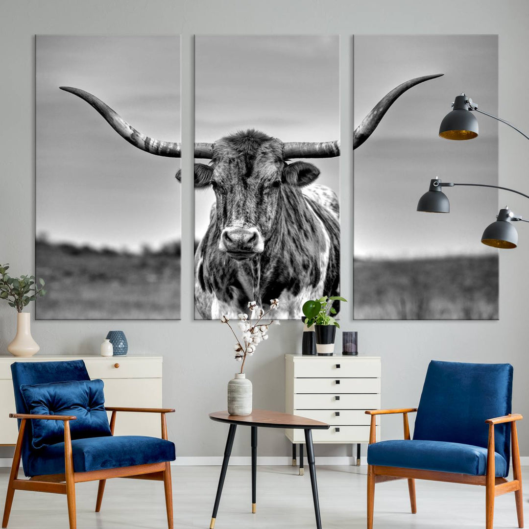 The Texas Longhorn Cow Wall Art, featuring a black and white image of a longhorn bull on canvas, brings charm to the room with its sophisticated appeal.