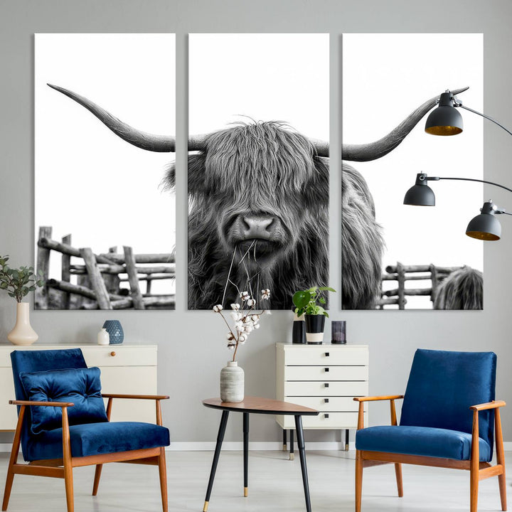 The Longhorn Canvas Print, featuring a black-and-white triptych of a Bighorn cow with shaggy fur and impressive long horns, is elegantly showcased. This wall art piece boasts a gallery-quality finish on premium canvas, bringing sophistication to any room.