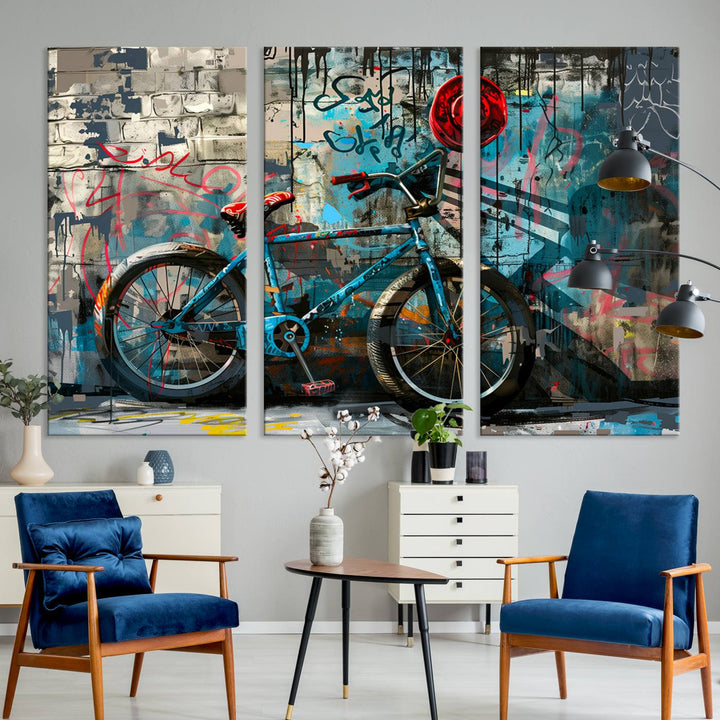 A modern living room features a triptych wall art of an abstract bicycle, designed in a graffiti style on a brick wall. This piece is expertly crafted on the Abstract Bicycle Wall Art Canvas Print, offering a premium canvas that ensures a gallery-quality finish.