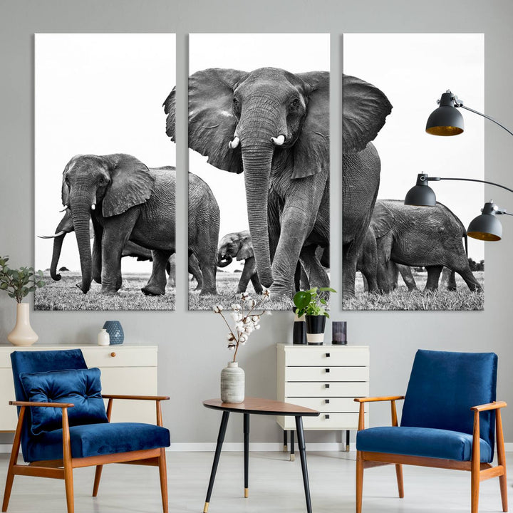 The Black White Elephant Family Wall Art Canvas Print features a triptych of elephants walking in the wild, crafted as gallery-quality wall art on premium canvas.