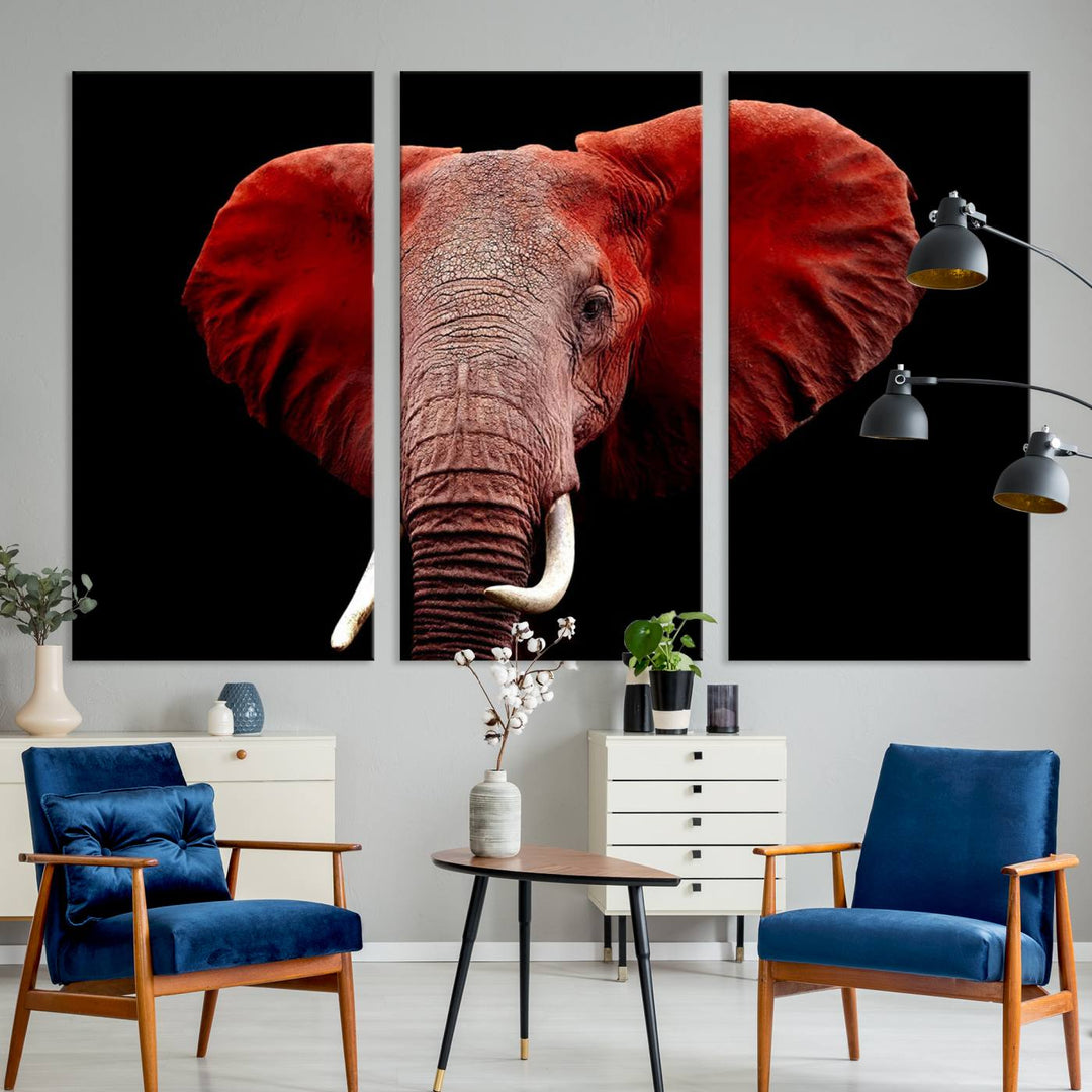 A Wall Art Canvas Print in the modern living room features a three-panel premium design of a red elephant face.