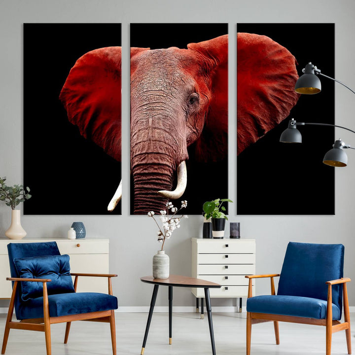 A Wall Art Canvas Print in the modern living room features a three-panel premium design of a red elephant face.