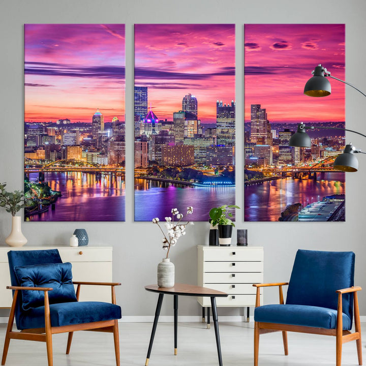 The Pittsburg Wall Art Canvas Print, showcasing a vibrant sunset glow over the city skyline and crafted by a professional artisan, adorns the space.