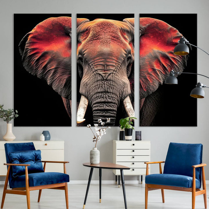 The Elephant Wall Art Canvas Print, featuring vibrant red and black tones, is a stunning artwork printed on museum-quality canvas. It comes with a UV-protective coating.