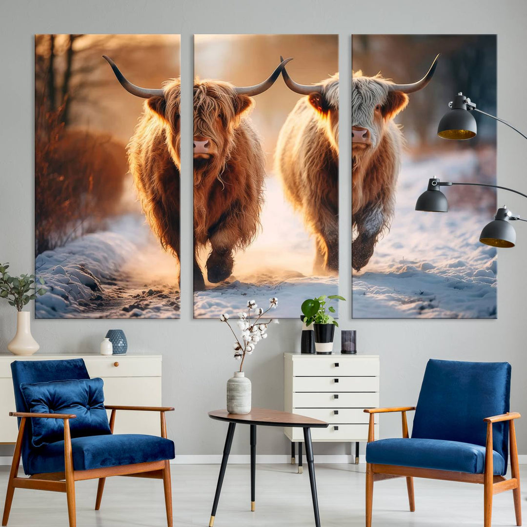 The living room showcases a triptych from the Scottish Highland Cow Horn Farm Wall Art Canvas Print collection, depicting two Highland cows running in the snow. Complementing this are handmade wall art pieces with a gallery-quality finish that add an elegant touch.