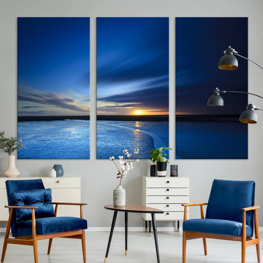 The living room features a triptych of the Wall Art Canvas Print Navy Sunset Lake Landscape Artwork, adding to its tranquil vibe.