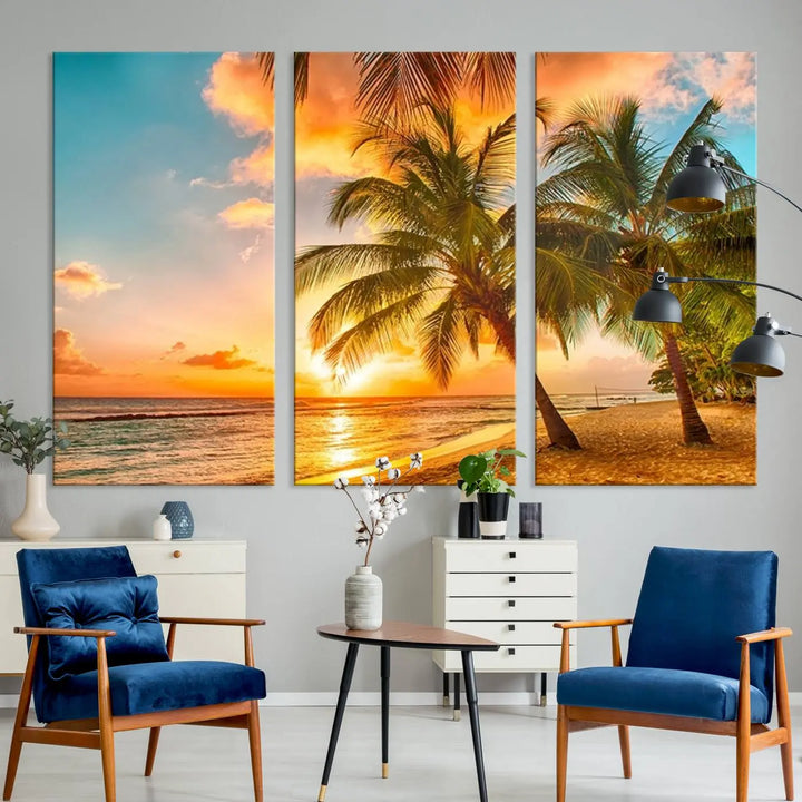 The Tropical Sunset Wall Art Print features a vibrant beach scene with palm trees and an ocean view highlighted by a golden sunset.