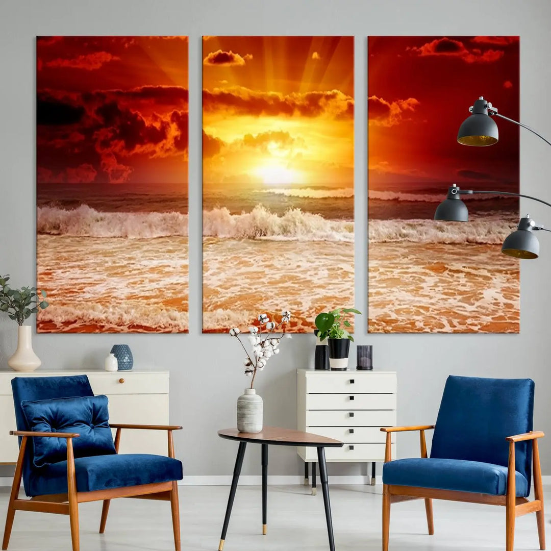 In a modern living room, the vibrant "Wall Art Canvas Perfect Sunset Turns Colour of Sea and Sky to Red," printed on museum-quality canvas, stands out. A floor lamp casts warm light over the ready-to-hang artwork, which includes a UV-protective coating to ensure lasting brilliance.