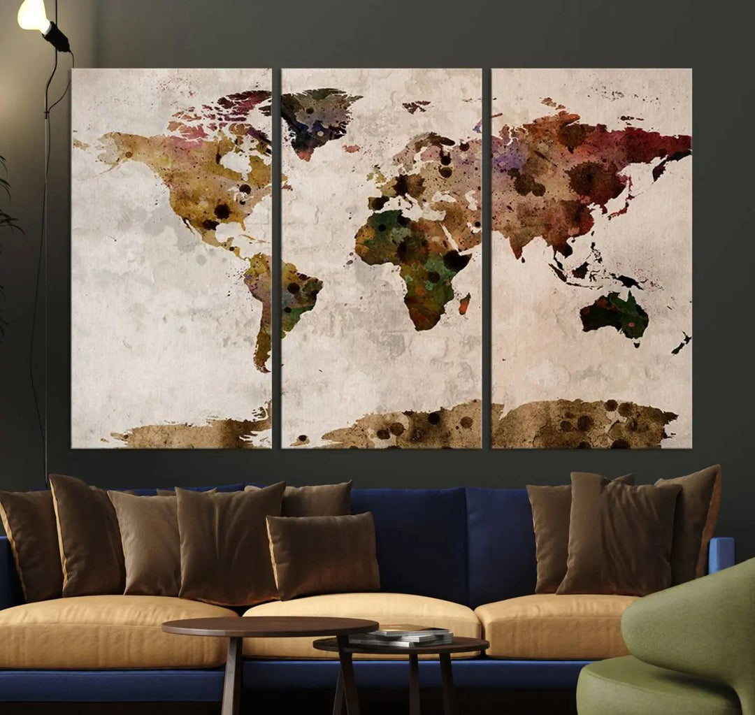 A Watercolor World Map Canvas Print, wrapped in an elegant gallery style, hangs on the wall.