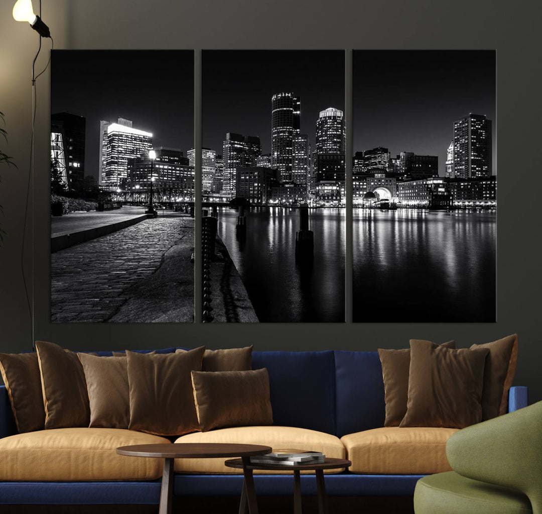 The Boston Lights Skyline Black and White Wall Art Cityscape Canvas Print, crafted with museum-quality canvas and UV-protective coating, serves as a striking triptych centerpiece in the living room.