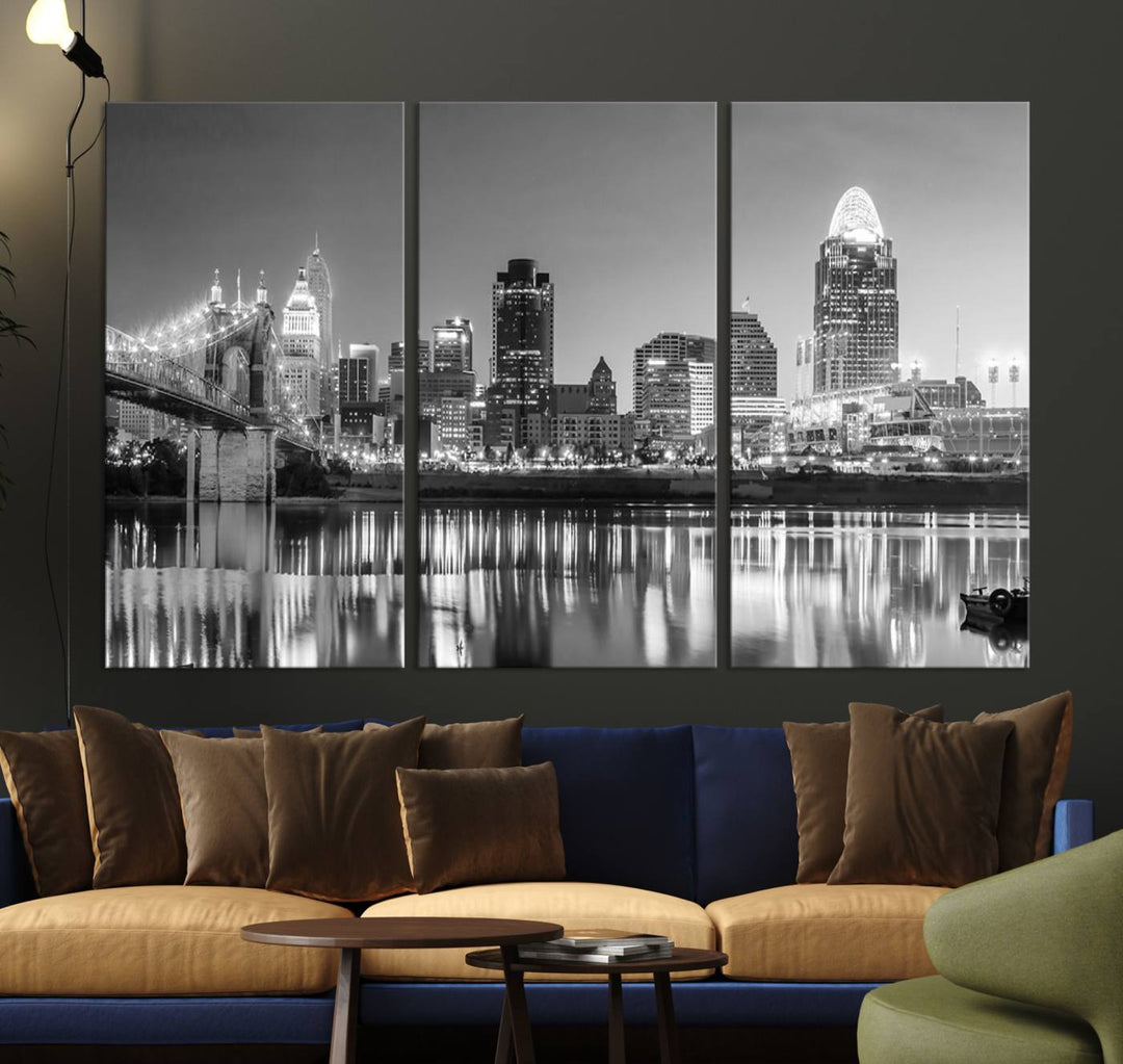 The "Cincinnati City Lights Skyline Black and White Wall Art Cityscape Canvas Print" is elegantly displayed in a stylish living room.