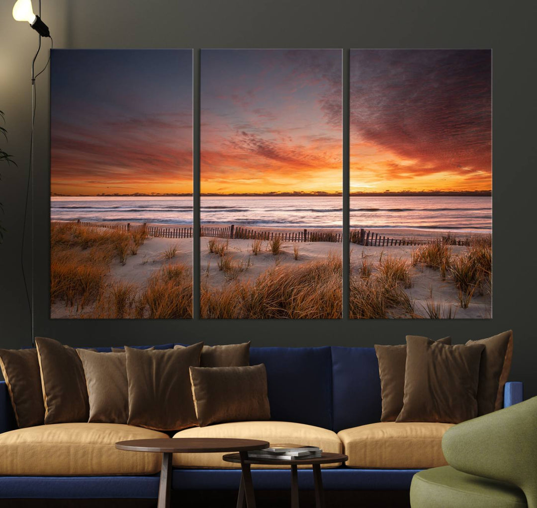 Sunset on The Beach Wall Art Canvas Print features a triptych of a beach at sunset with vivid orange skies, presented on museum-quality canvas. Each section is gallery wrapped, offering lasting beauty with its UV-protective coating.